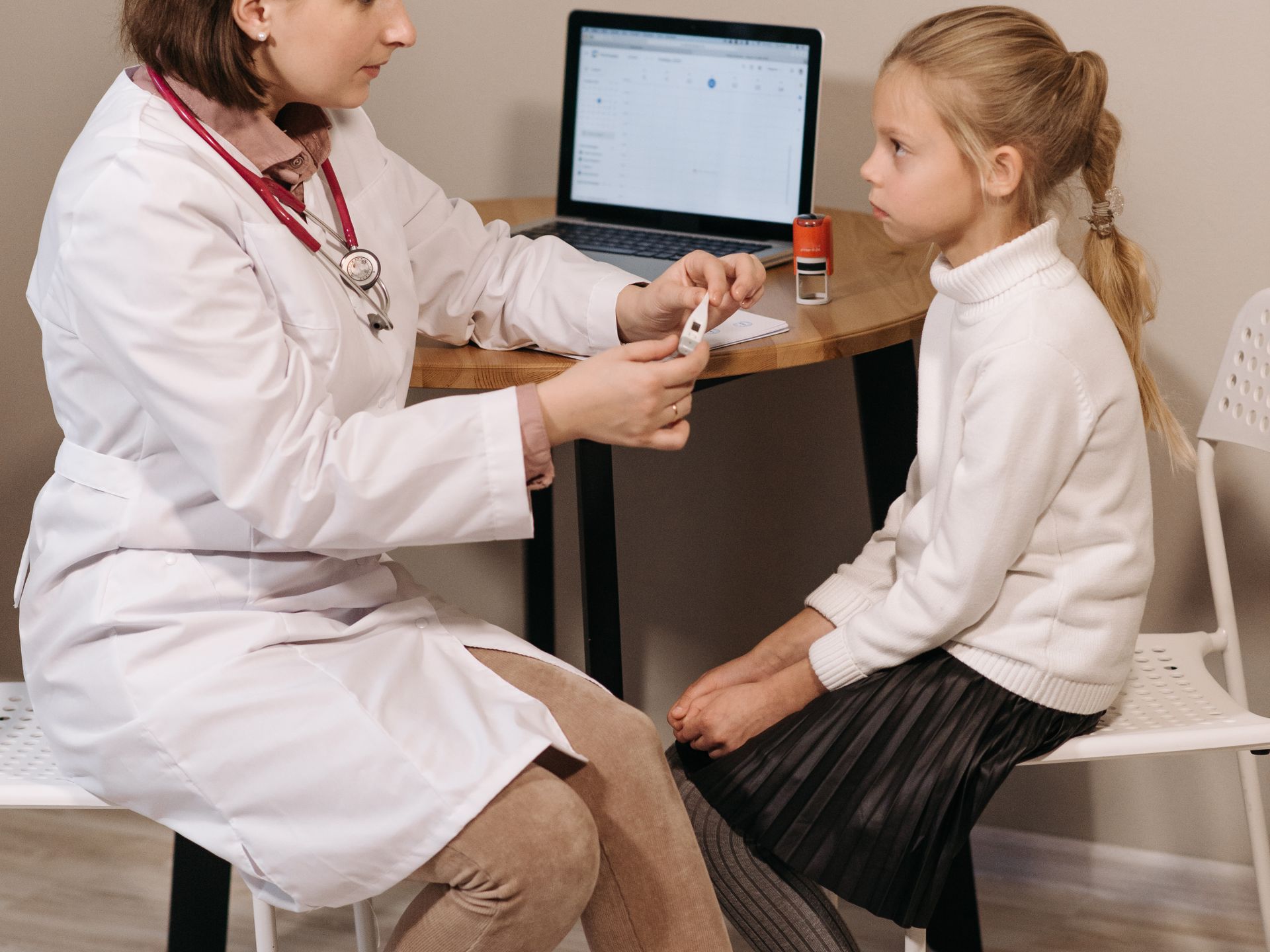 Pediatric consultation — doctor examining child patient at Laraib Health Clinic